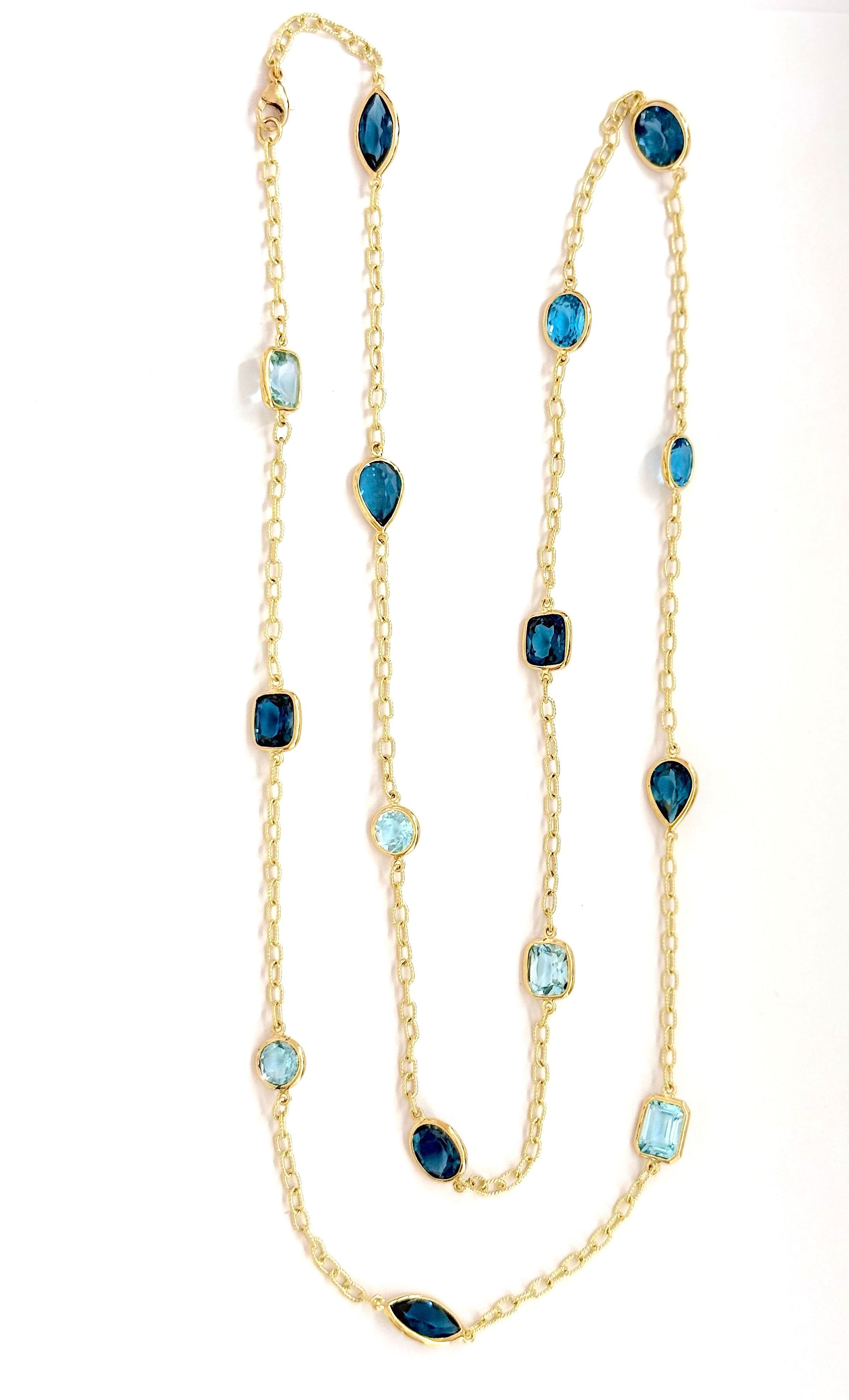Elegant Three-Stone Drop Earring with Blue Topaz and Baroque Pearl