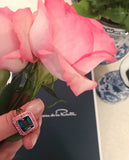 Rose Gold Bezel Set Dark Blue Topaz with Surrounding Pink Sapphire Ring