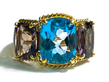 18kt Yellow Gold Three Stone Ring with Pink Topaz and Blue Topaz and Rope Twist Border