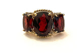 Elegant Three Stone Garnet Ring with Gold Rope Twist Border