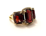 Elegant Three Stone Garnet Ring with Gold Rope Twist Border